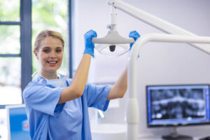 A dental nurse smiling with her patient