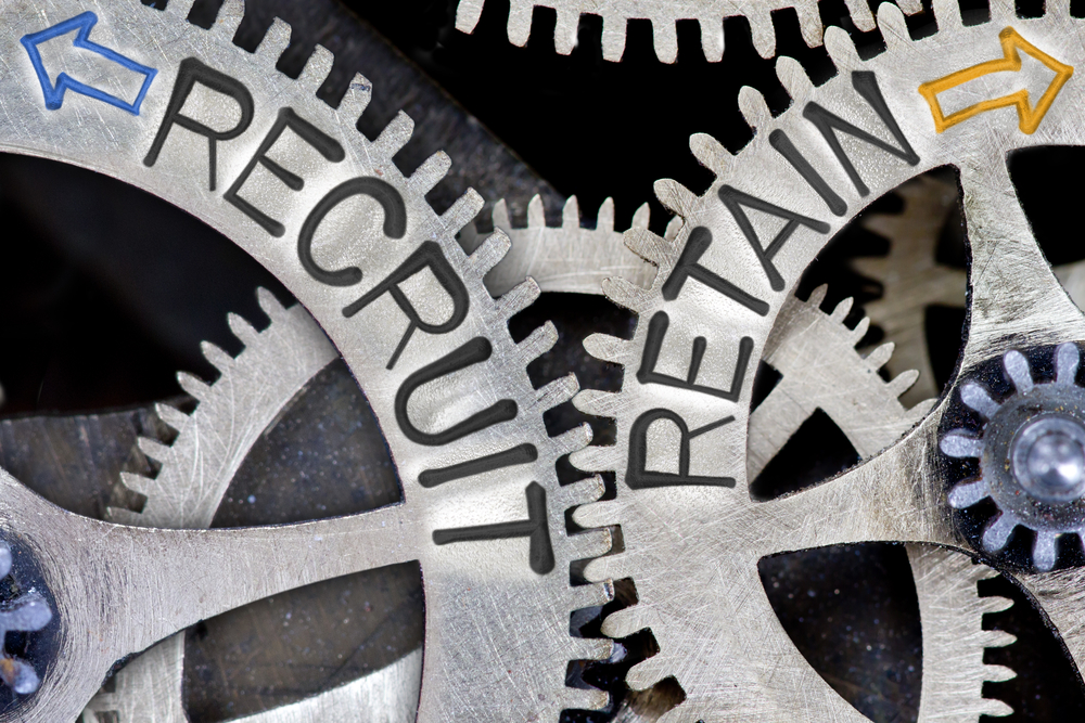 Two mechanical wheels showing the relationship between recruitment and retention.