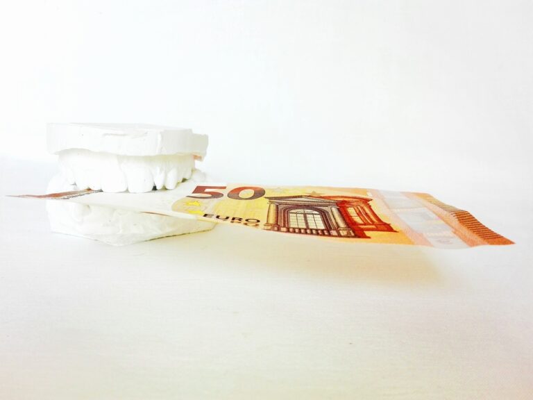 A set of teeth holding money