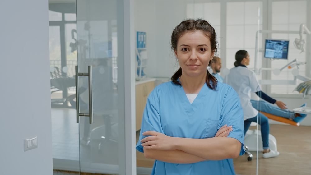 a dental nurse stood in front of the dental team